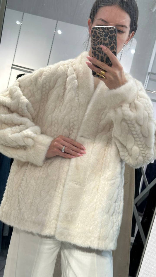 Elegant white fur jacket.