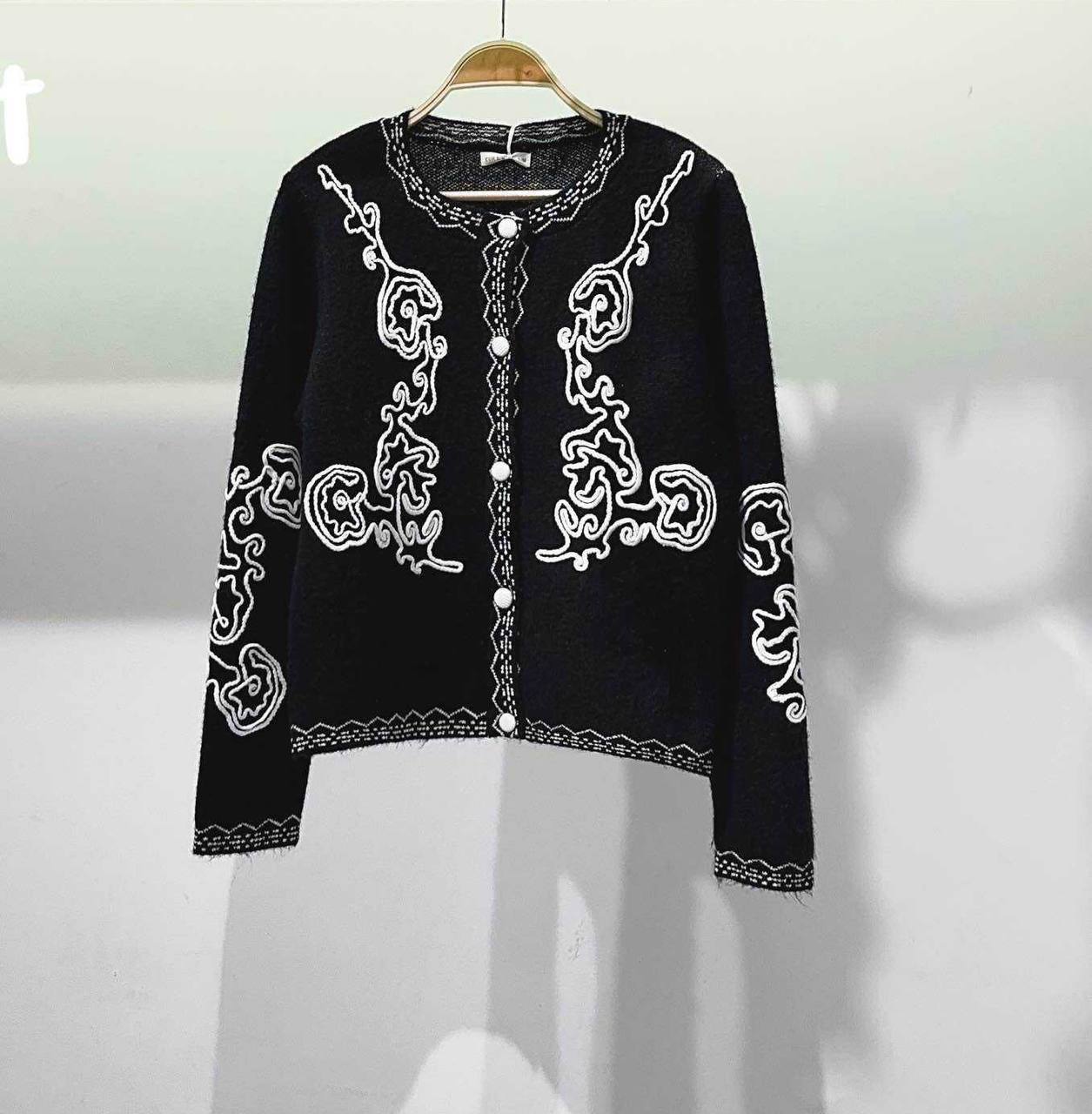 A cardigan with textured embroidery