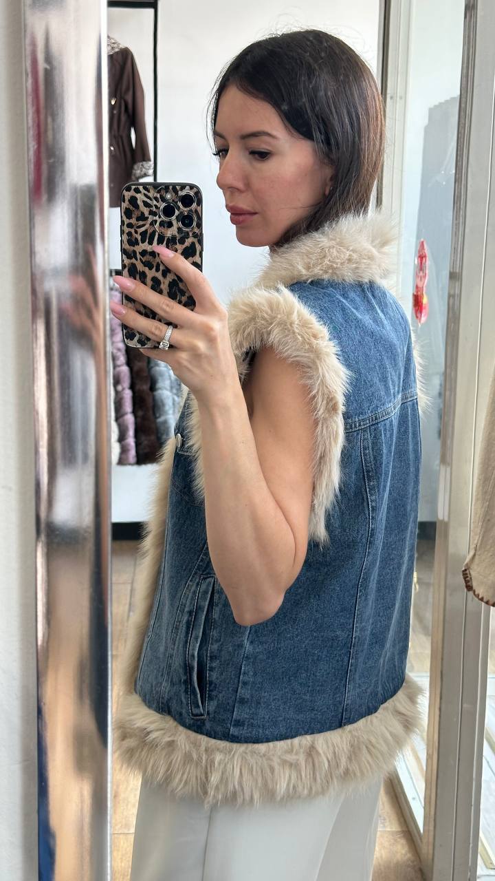 A medium-length denim vest