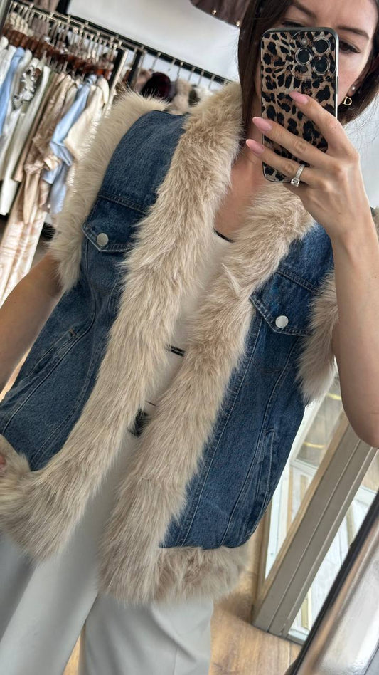 A medium-length denim vest