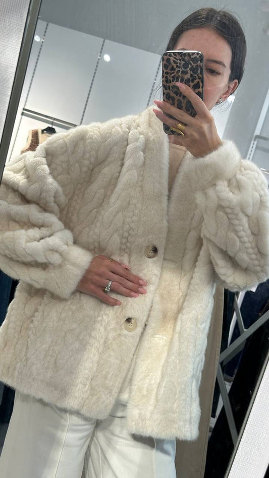 Elegant white fur jacket.