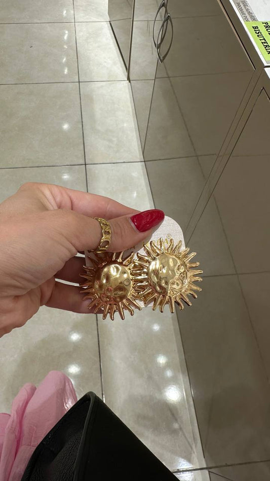 Earrings in the shape of the sun