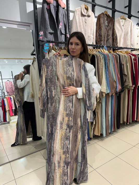 Dress in the length of maxi in neutral shades