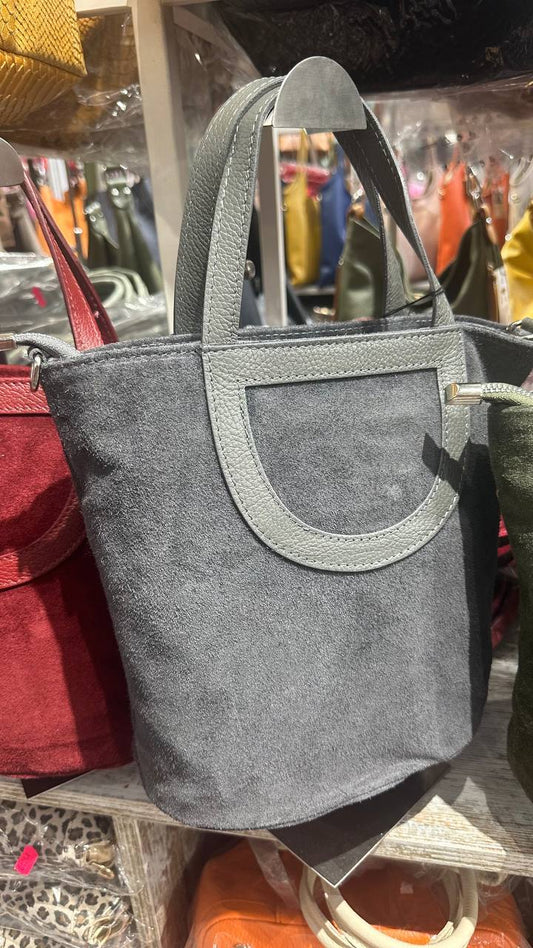 The bag is made of natural suede