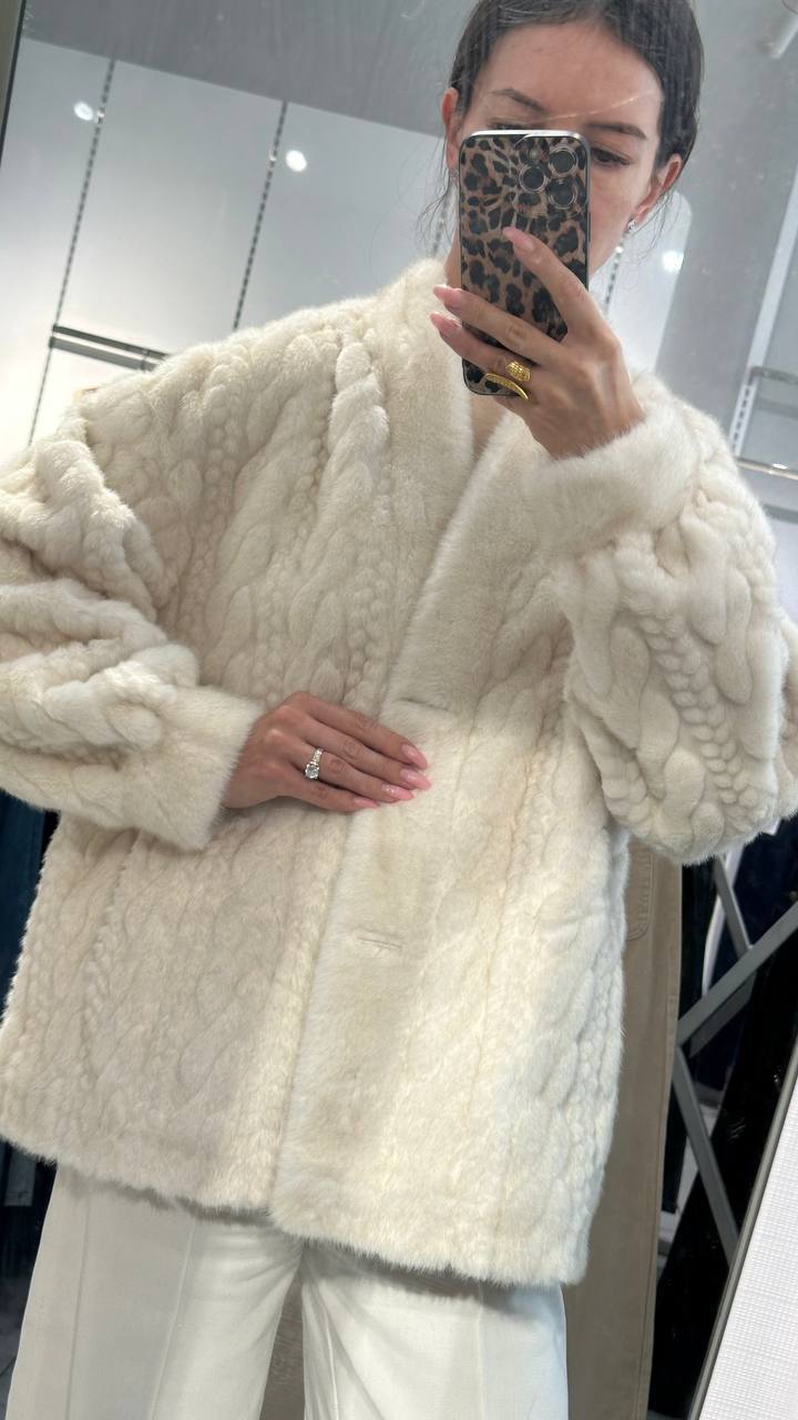 Elegant white fur jacket.