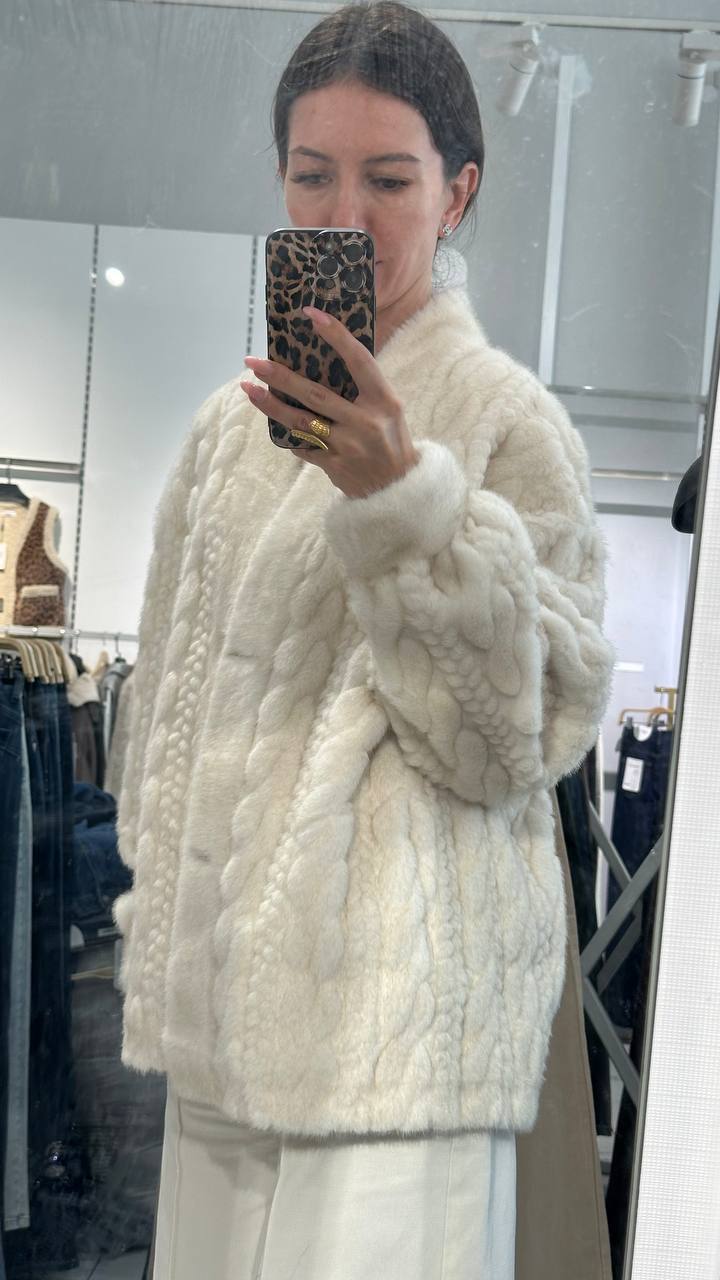 Elegant white fur jacket.